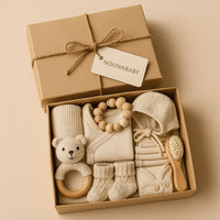  Coffret cadeau de naissance luxe Nounababy. Boîte ouverte avec body en coton bio et bonnet assorti. Idée cadeau parfait pour nouveau-né à Dakar, Sénégal.
