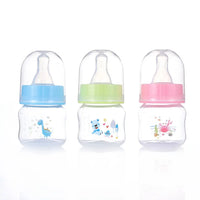 Biberons bébé 50ml avec bouchon et tétine - modèles colorés disponibles à Dakar