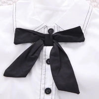 ensemble en coton noir blanc avec zoom sur le  nœud fille de la boutique nounababy Dakar Senegal