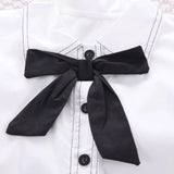 ensemble en coton noir blanc avec zoom sur le  nœud fille de la boutique nounababy Dakar Senegal