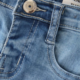 Détail couture et broderie étoilée sur jean fille coton doux – boutique NounaBaby Dakar.