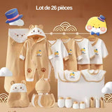 Détail des 26 pièces du coffret naissance : combinaisons, bonnet, coussin tête, bavoirs, moufles, couverture – coffret complet pour nouveau-né à Dakar.