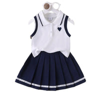 Ensemble fille polo blanc jupe plissée bleue marine style preppy boutique enfant Dakar NounaBaby