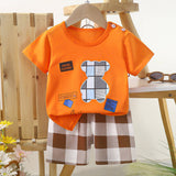 ensemble pour bébé et enfant chez nounababy Dakar Sénégal , motif ours de couleur t-shirt orange et short carreaux marron, blanc

